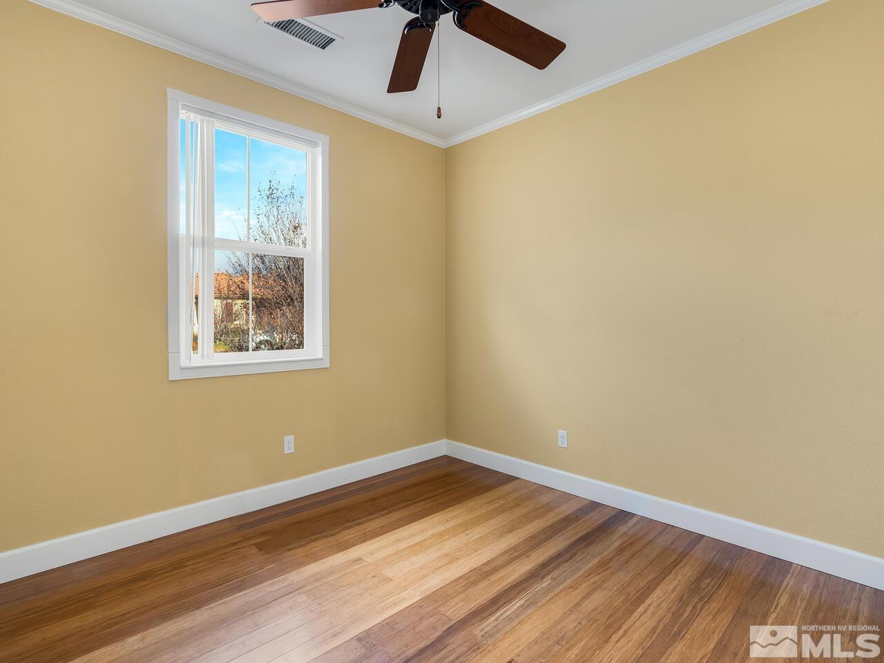 2080 Whitecliff Drive Reno, NV 89521 - Photo 16 of 21 a view of empty room with wooden floor