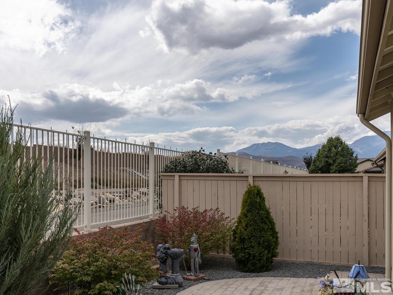 2080 Whitecliff Drive Reno, NV 89521 - Photo 20 of 21 a view of a garden with a iron fence
