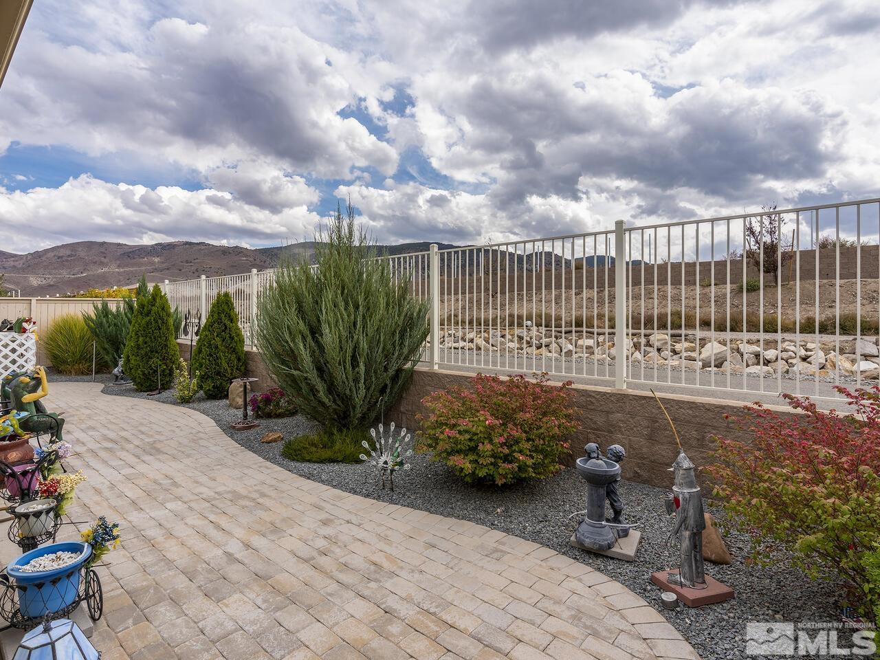 2080 Whitecliff Drive Reno, NV 89521 - Photo 21 of 21 a view of a garden with plants and wooden fence