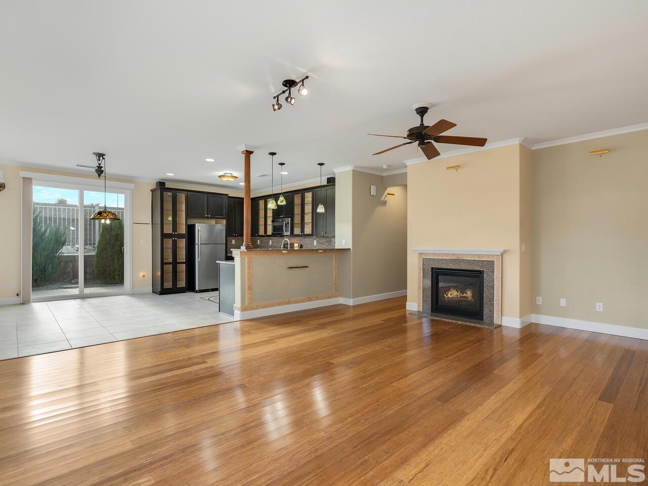 2080 Whitecliff Drive Reno, NV 89521 - Photo 3 of 21 a view of a livingroom with a fireplace and wooden floor