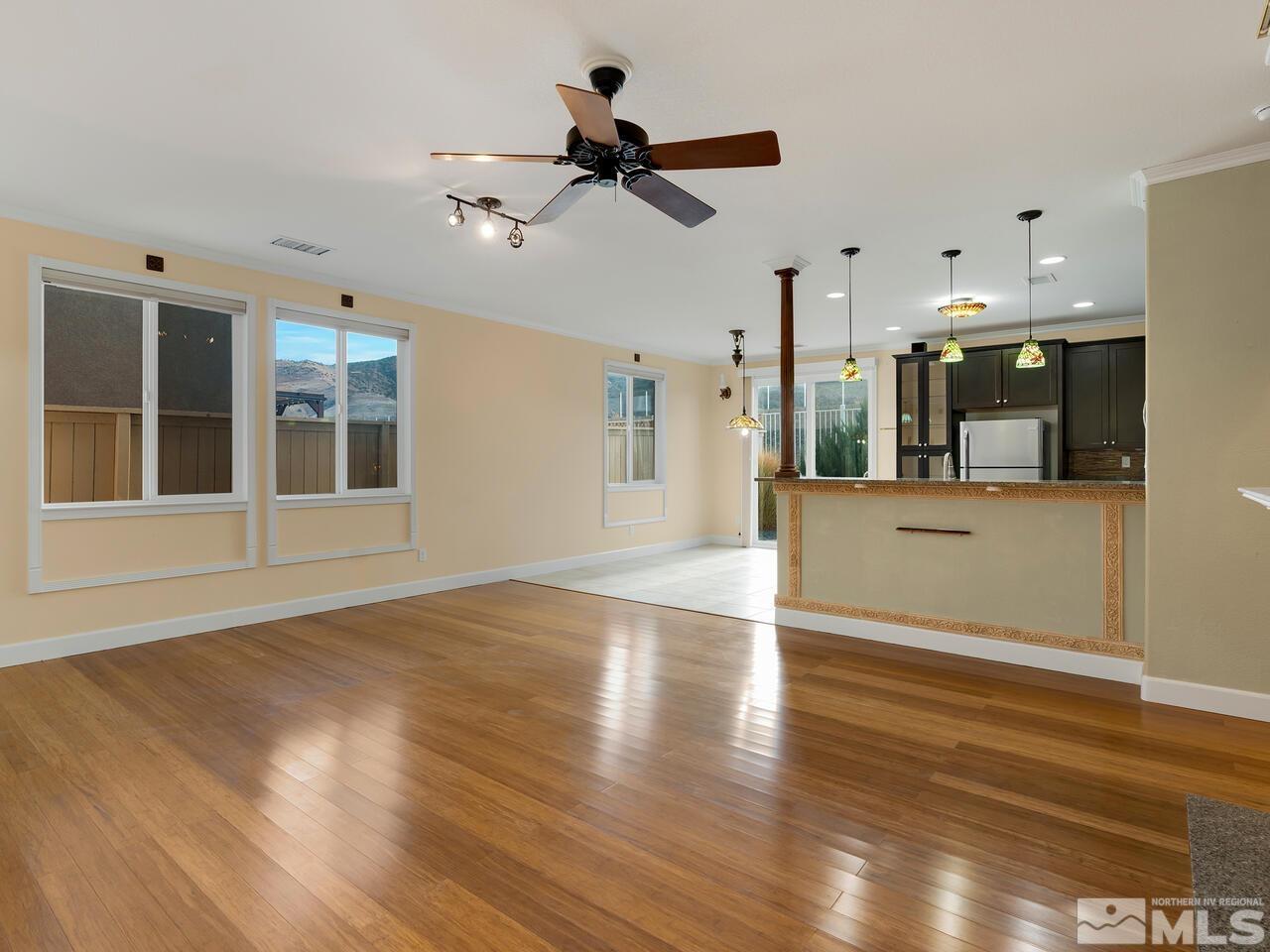 2080 Whitecliff Drive Reno, NV 89521 - Photo 5 of 21 a view of a livingroom with a kitchen and wooden floor