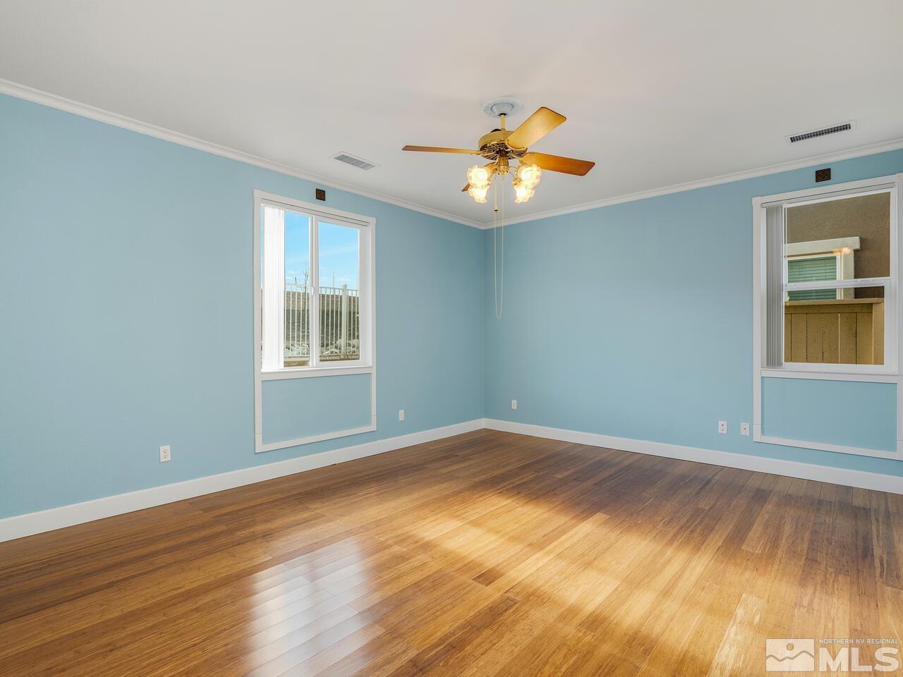 2080 Whitecliff Drive Reno, NV 89521 - Photo 10 of 21 a view of an empty room with wooden floor and a window