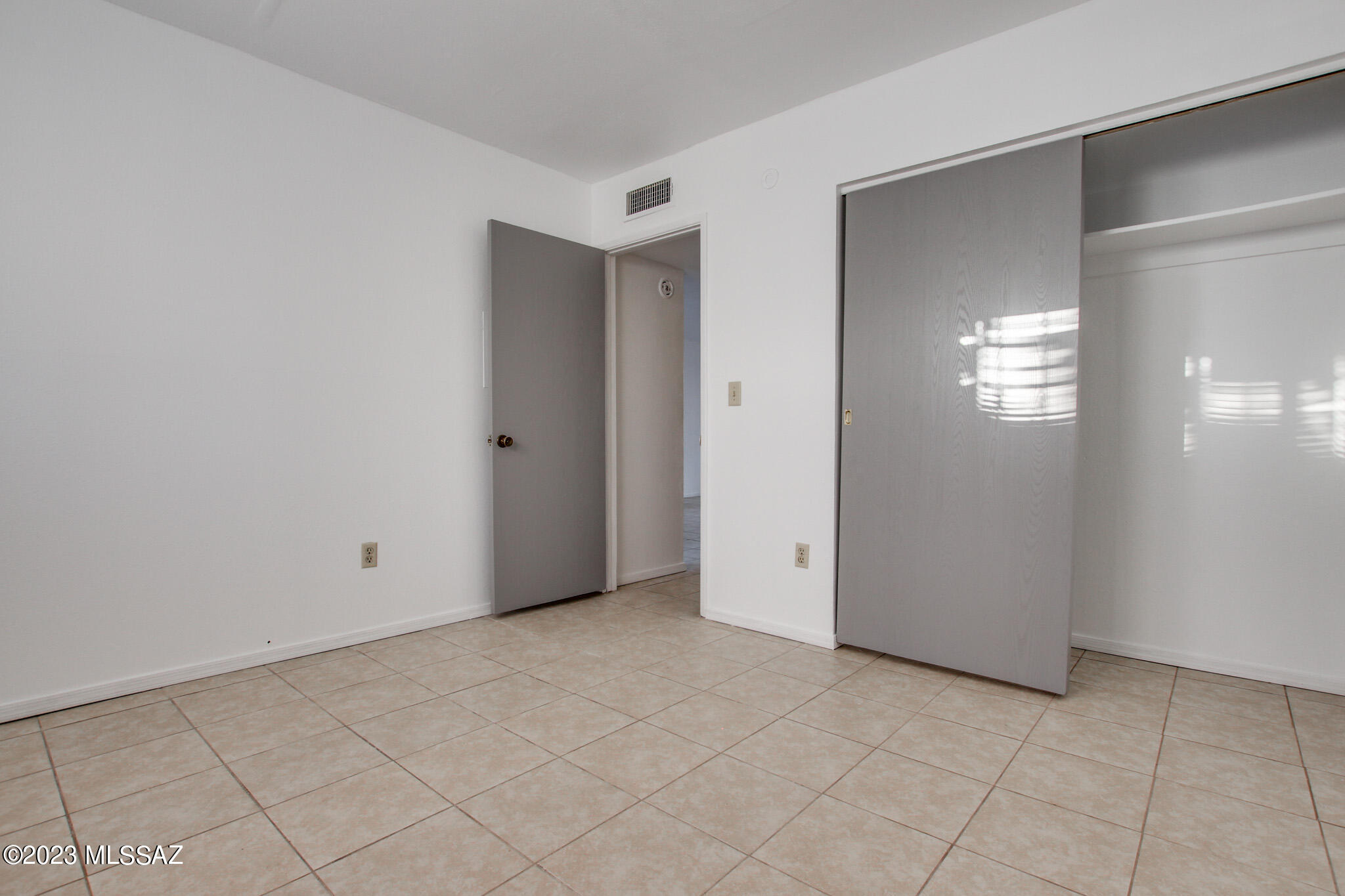 1063 East Halcyon Road Tucson, AZ 85719 - Photo 7 of 35 a view of an empty room with window and stairs