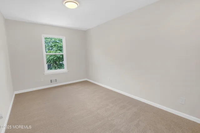 a car parked in front of a white building