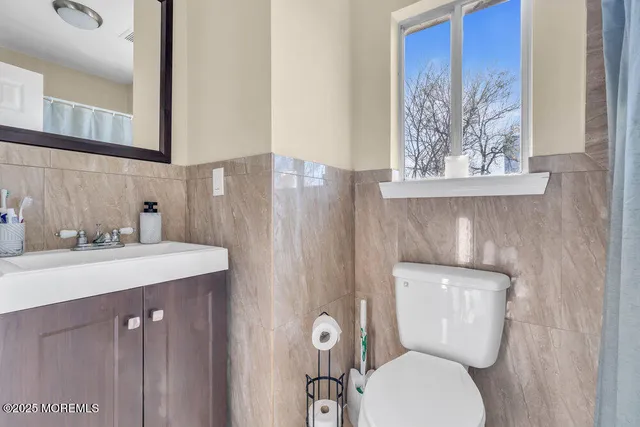 a bathroom with a toilet and a sink