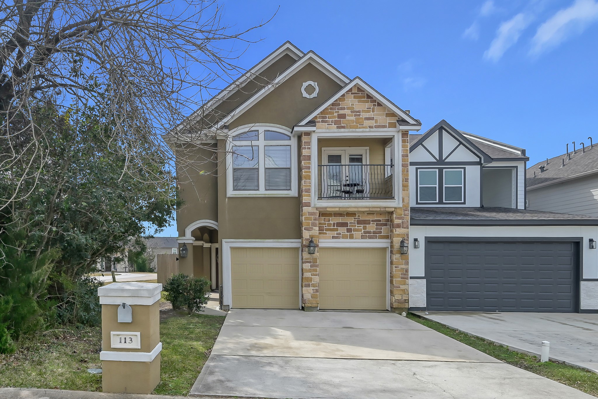 a front view of a house with a garage