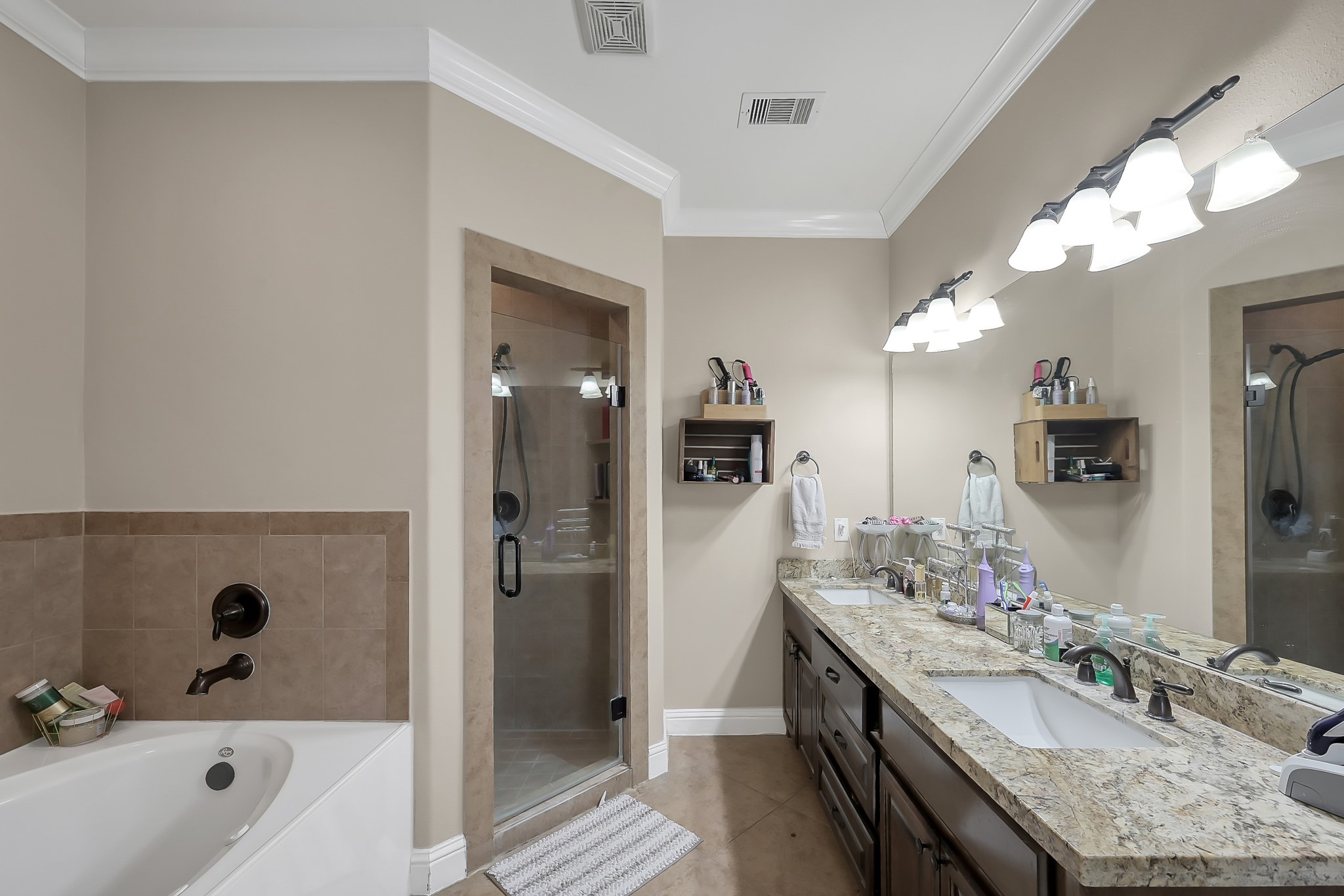 113 Capetown Way Montgomery, TX 77356 - Photo 18 of 39 a bathroom with a granite countertop sink mirror and shower