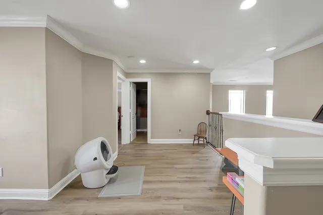 a room with wooden floor and furniture