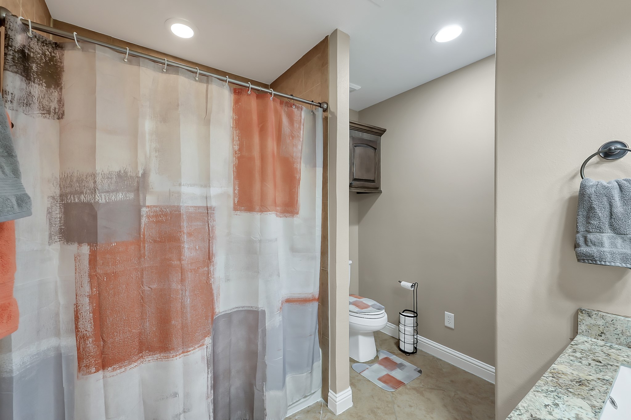 113 Capetown Way Montgomery, TX 77356 - Photo 25 of 39 a bathroom with a shower curtain and a toilet