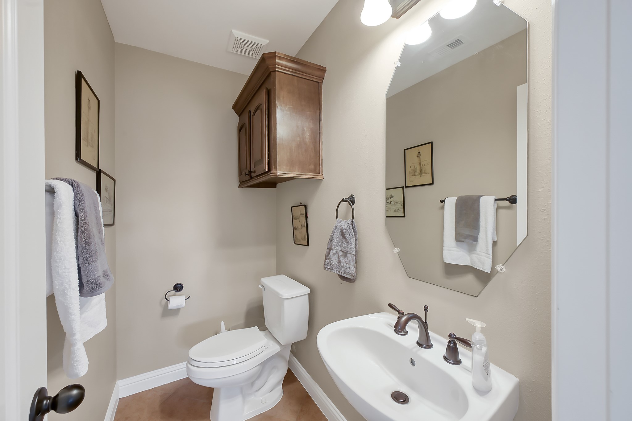 113 Capetown Way Montgomery, TX 77356 - Photo 29 of 39 a bathroom with a toilet sink and mirror