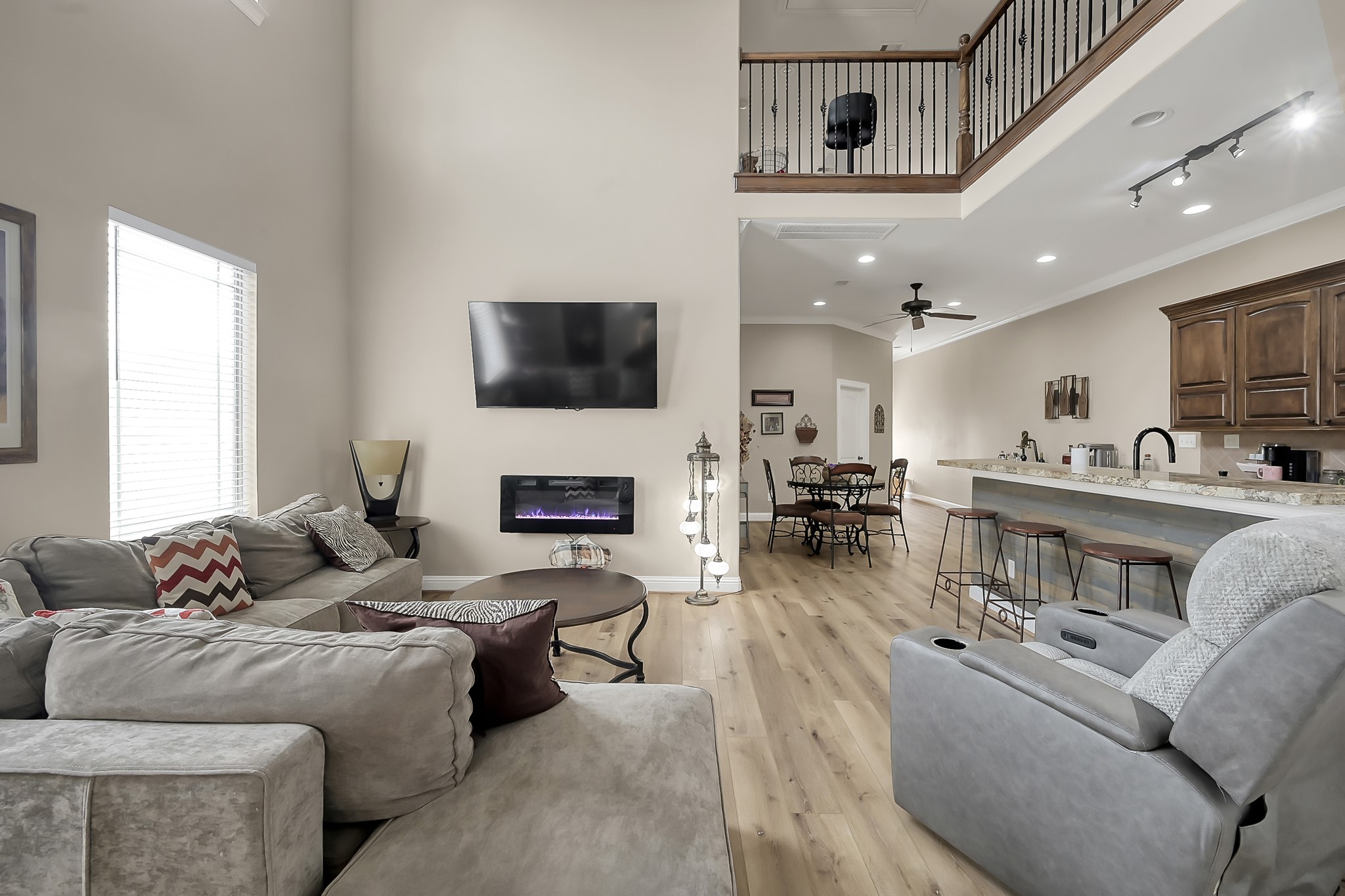 113 Capetown Way Montgomery, TX 77356 - Photo 6 of 39 a living room with furniture a fireplace and a flat screen tv