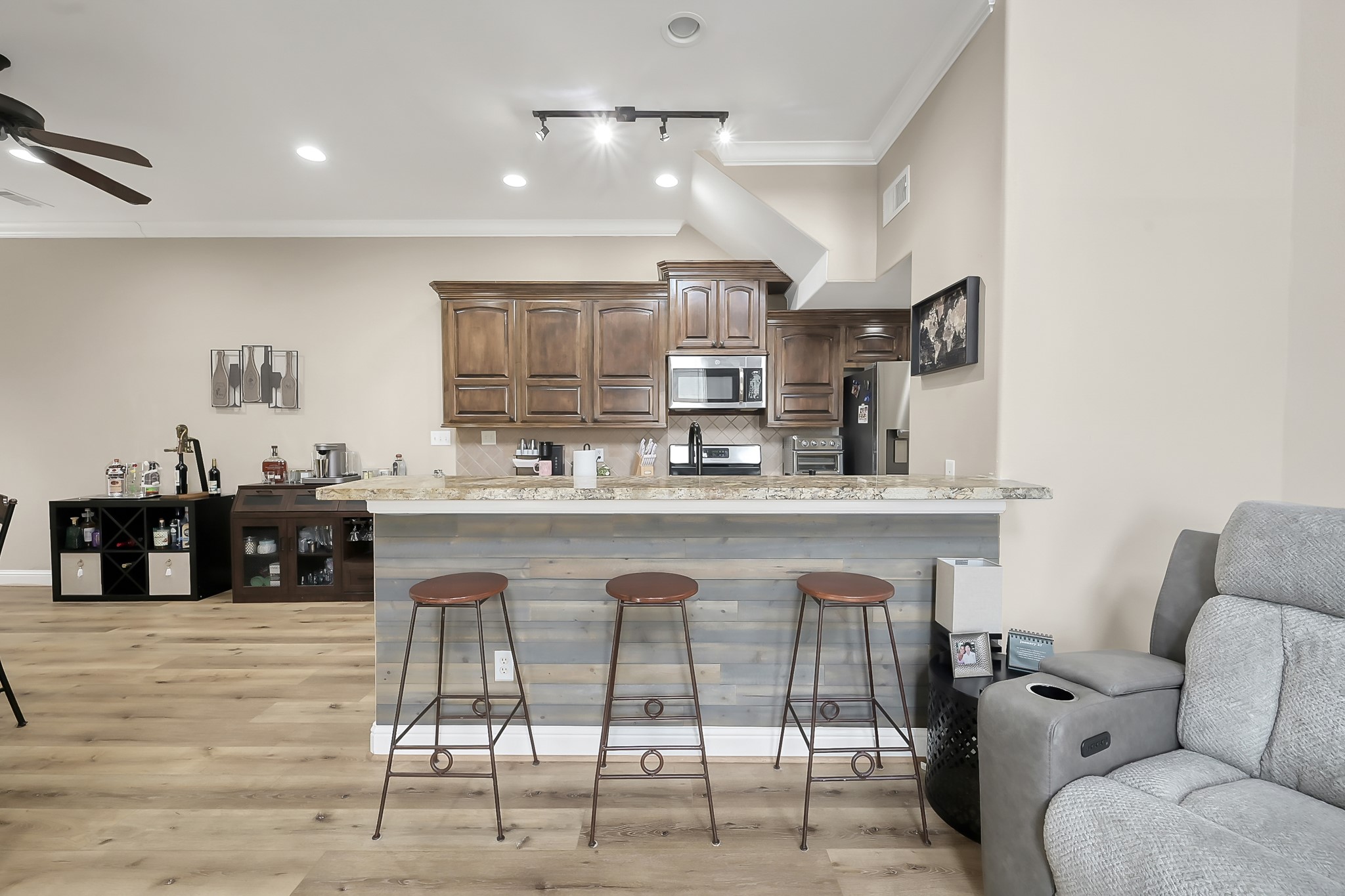 113 Capetown Way Montgomery, TX 77356 - Photo 9 of 39 a kitchen with stainless steel appliances kitchen island granite countertop a sink and cabinets