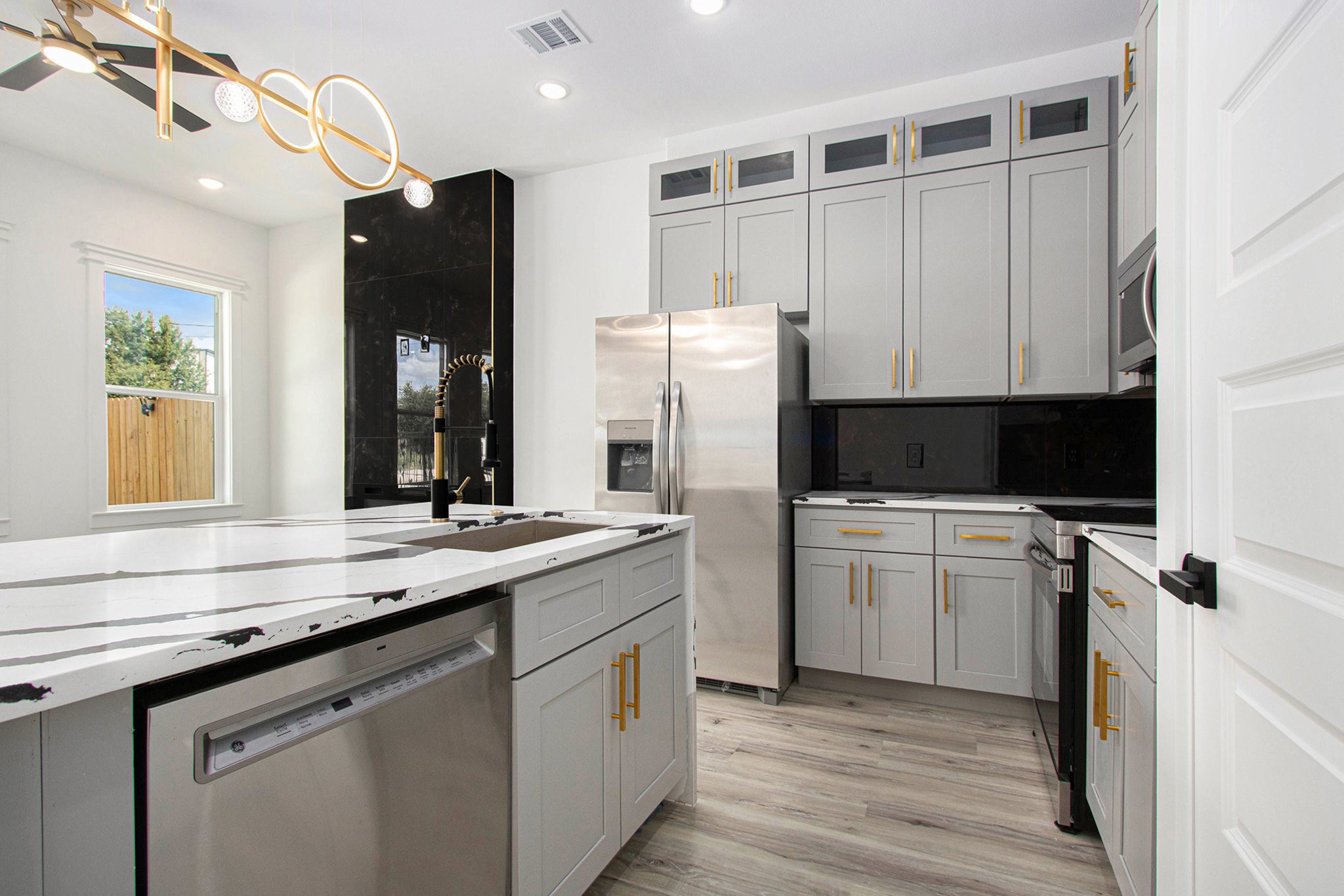 3652 Seabrook Street, Unit A Houston, TX 77021 - Photo 11 of 27 a kitchen with a sink cabinets and stainless steel appliances