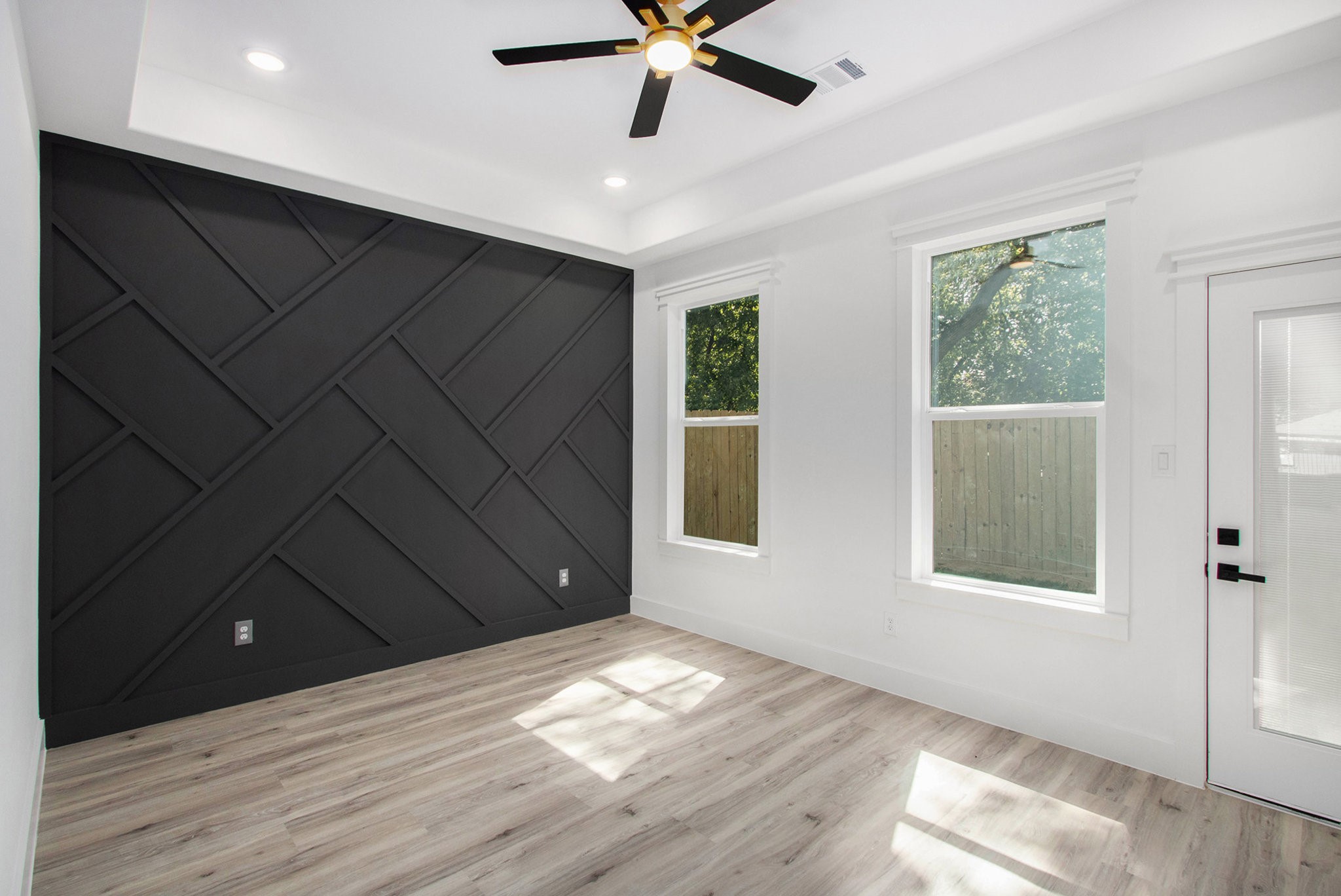 3652 Seabrook Street, Unit A Houston, TX 77021 - Photo 15 of 27 a view of an empty room with wooden floor and a window