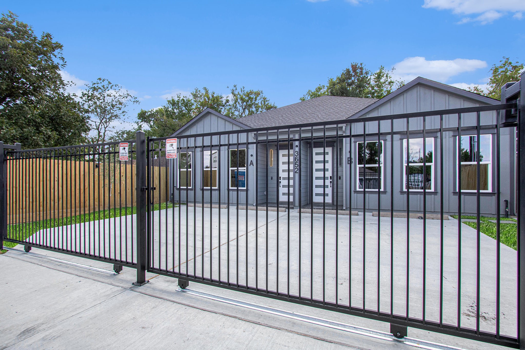 3652 Seabrook Street, Unit A Houston, TX 77021 - Photo 2 of 27 a view of a brick house and wooden fence