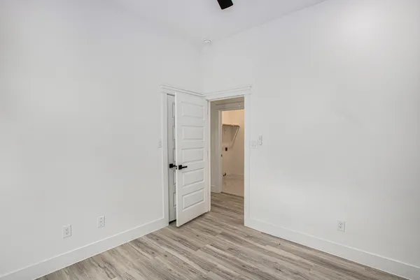 an empty room with wooden floor