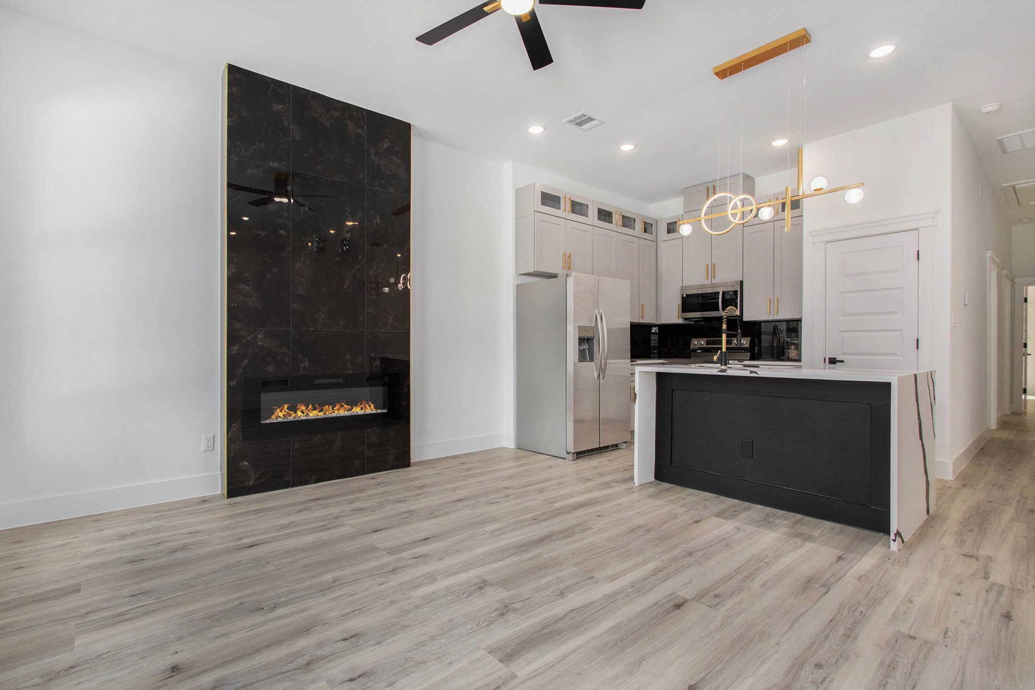 3652 Seabrook Street, Unit A Houston, TX 77021 - Photo 9 of 27 a kitchen with stainless steel appliances kitchen island granite countertop a refrigerator and a sink
