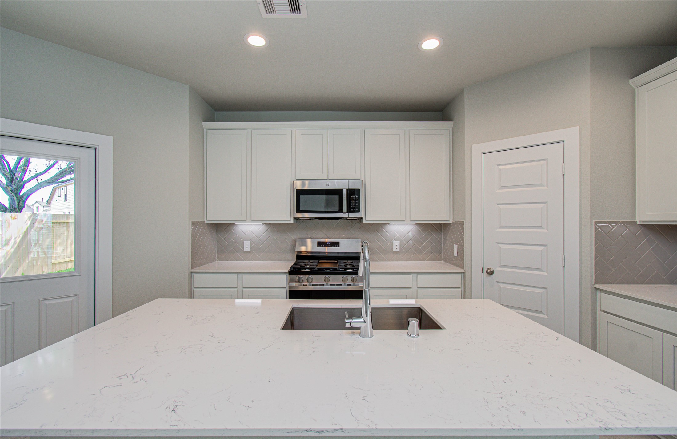 15723 Telge Ridge Lane Cypress, TX 77429 - Photo 11 of 31 a kitchen with a refrigerator and a stove top oven