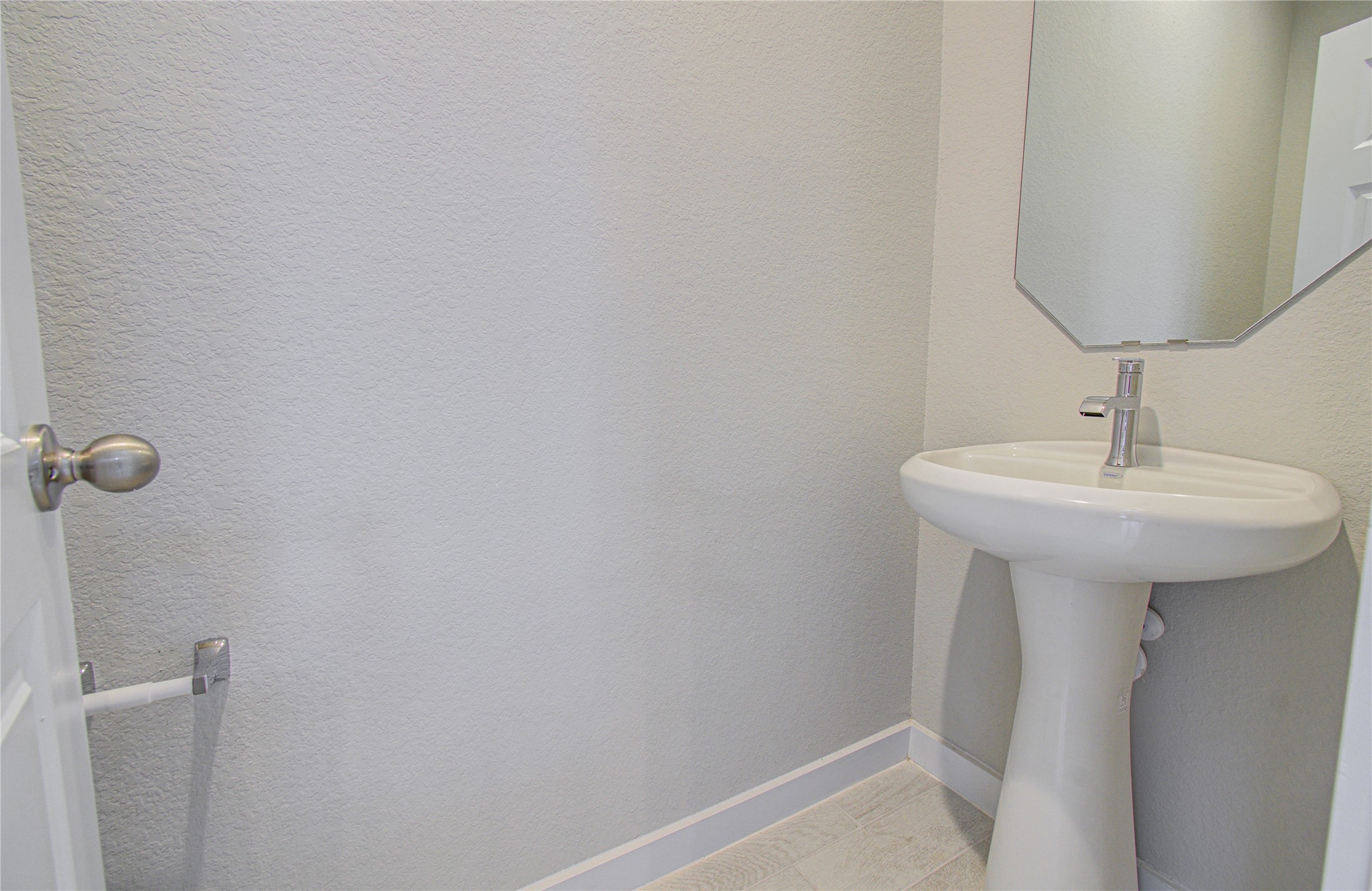 15723 Telge Ridge Lane Cypress, TX 77429 - Photo 12 of 31 a bathroom with a sink a mirror and shower
