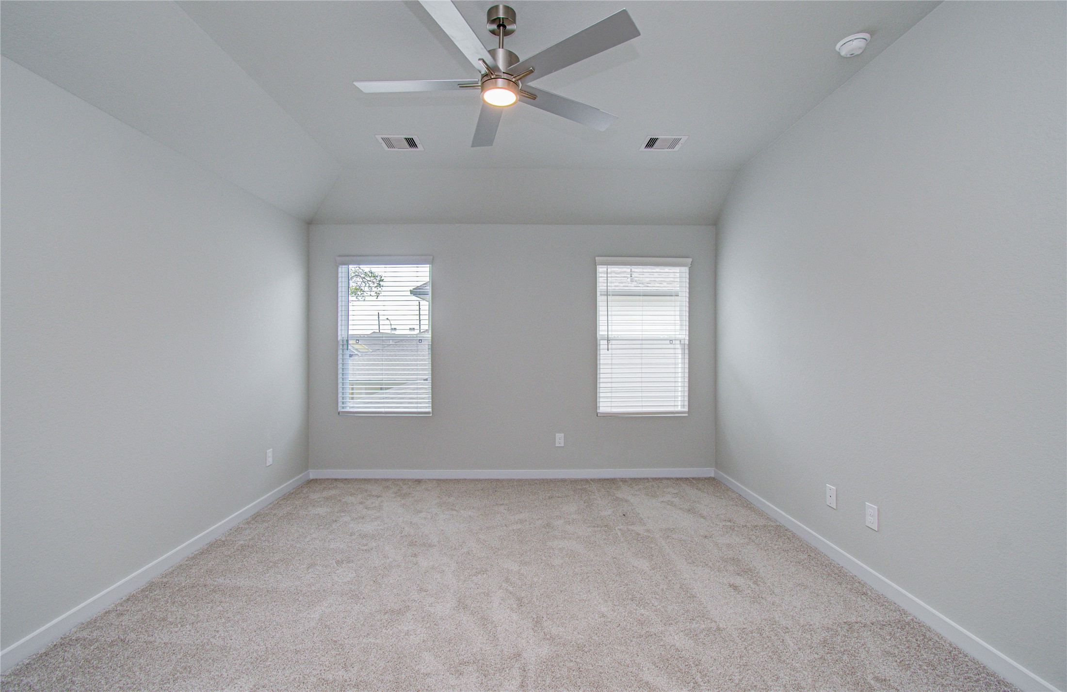 15723 Telge Ridge Lane Cypress, TX 77429 - Photo 14 of 31 an empty room with windows and fan