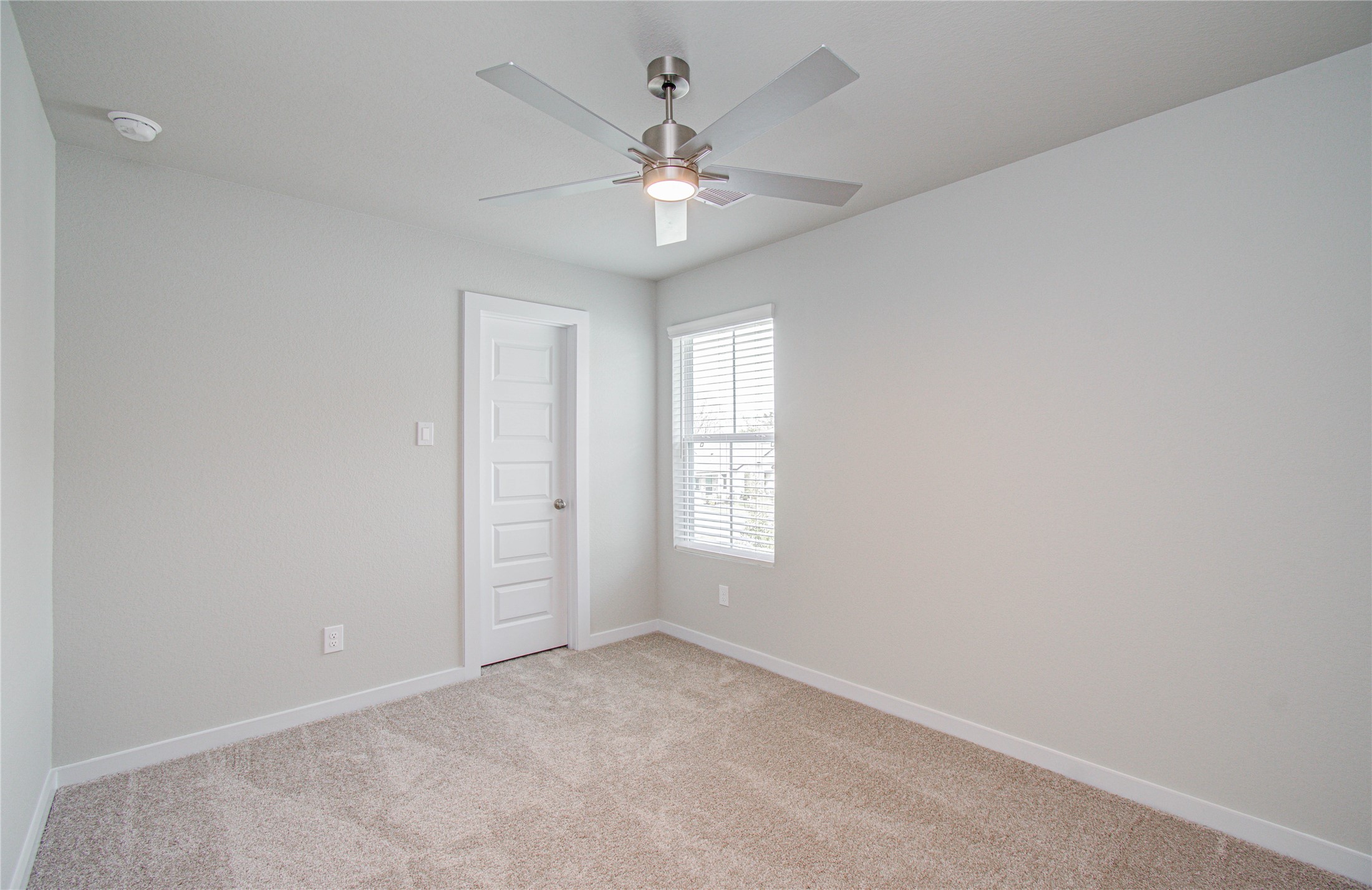 15723 Telge Ridge Lane Cypress, TX 77429 - Photo 23 of 31 an empty room with windows and chandelier fan
