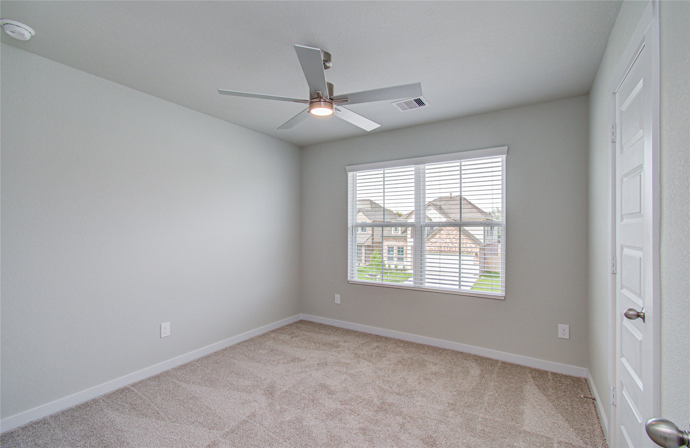 15723 Telge Ridge Lane Cypress, TX 77429 - Photo 25 of 31 an empty room with a window and a fan