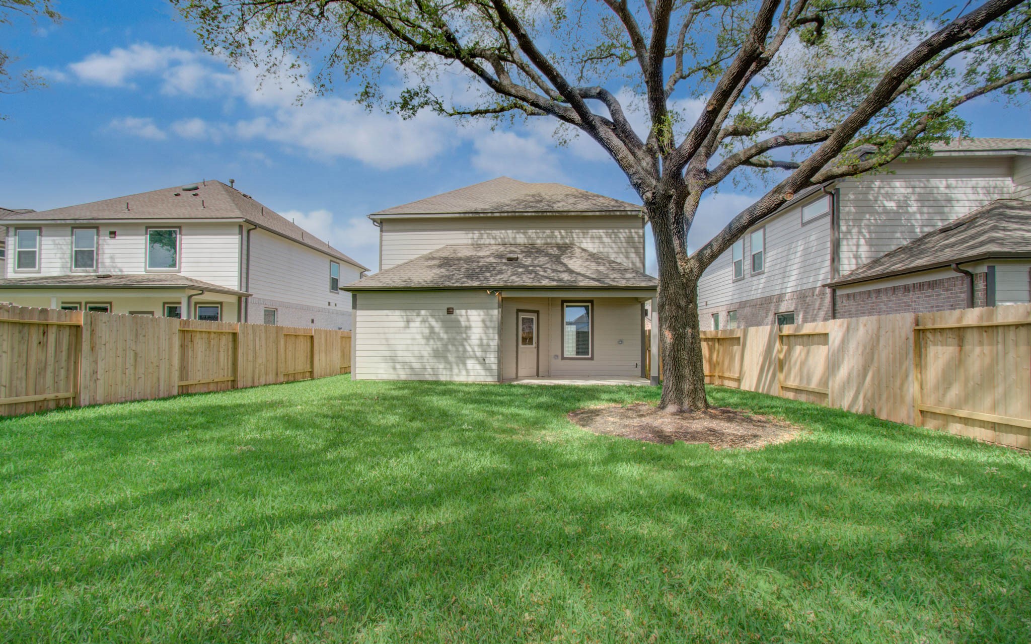 15723 Telge Ridge Lane Cypress, TX 77429 - Photo 30 of 31 a view of a yard in front of a house with large tree