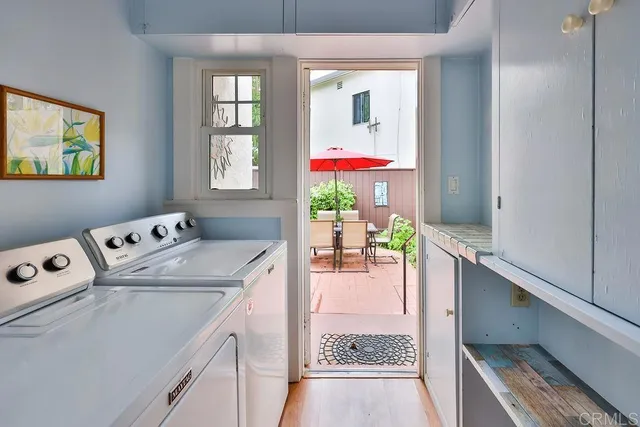 a bedroom with bed tv and window