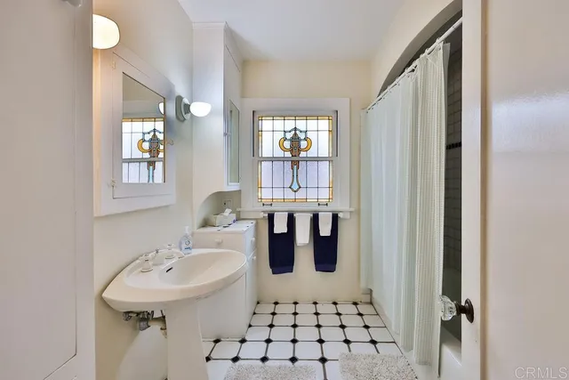 a bedroom with furniture and a window