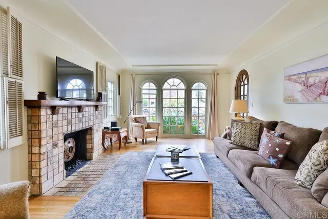 a living room with furniture fireplace and flat screen tv