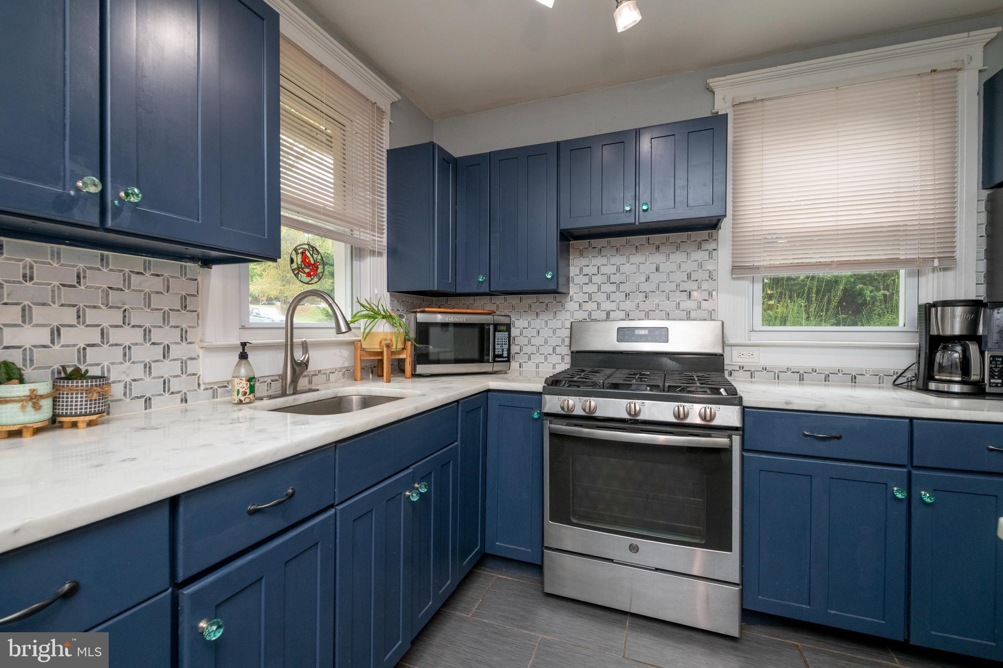 514 Warren Road Cockeysville, MD 21030 - Photo 11 of 55 Kitchen has granite counters and marble backsplash