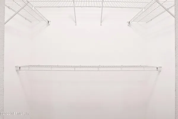 a view of a room with racks on the wall