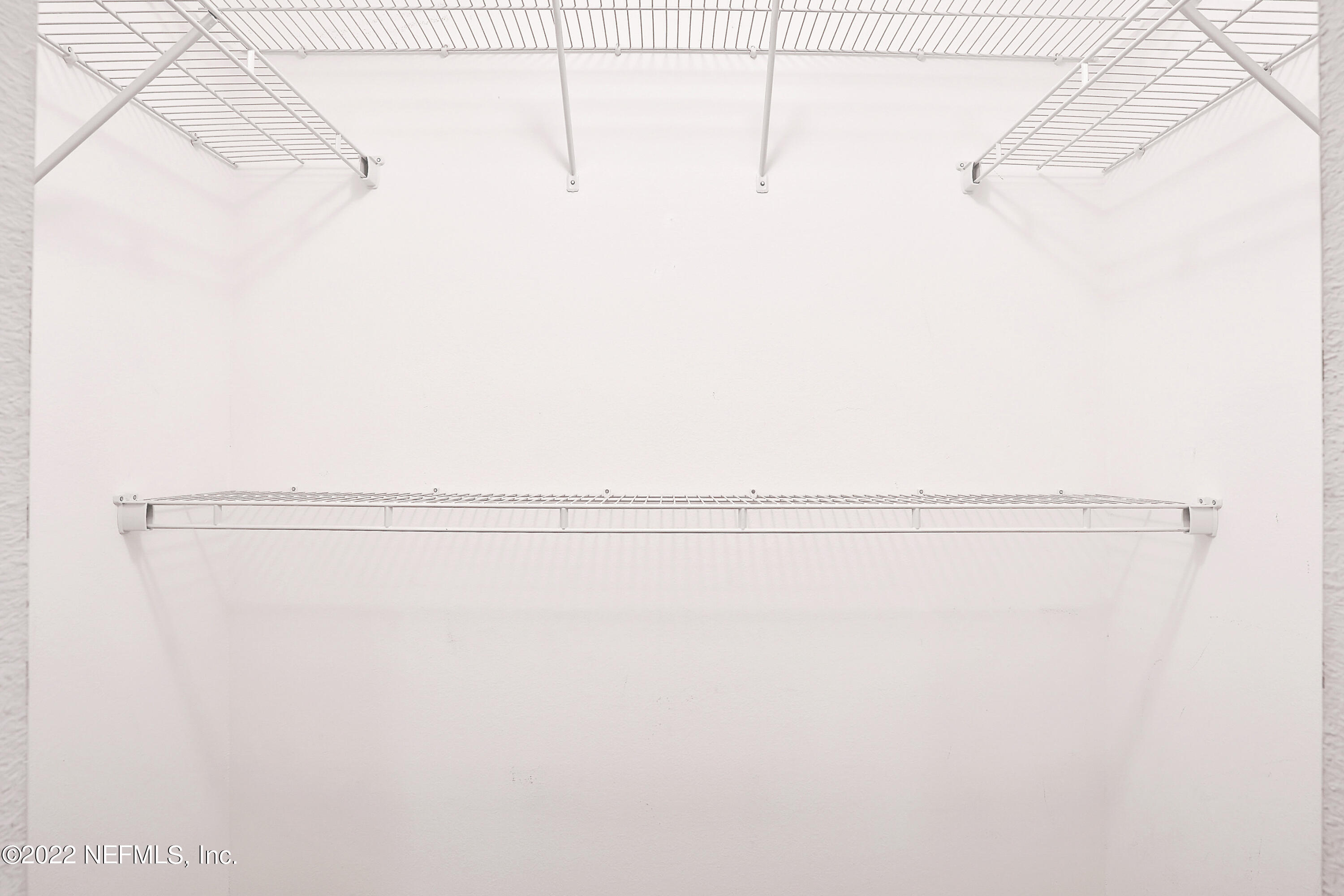 11 Wheatfield Drive Palm Coast, FL 32164 - Photo 11 of 36 a view of a room with racks on the wall