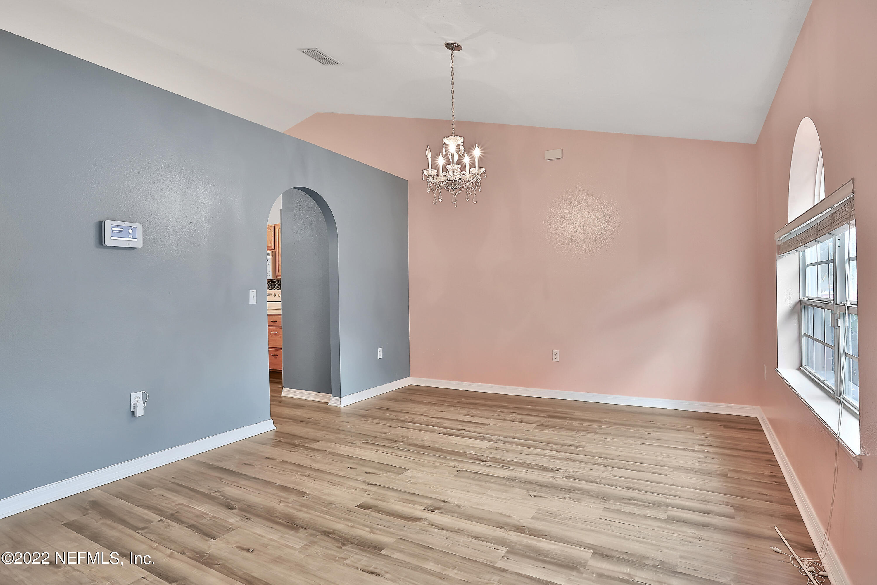 11 Wheatfield Drive Palm Coast, FL 32164 - Photo 15 of 36 wooden floor in an empty room with a window
