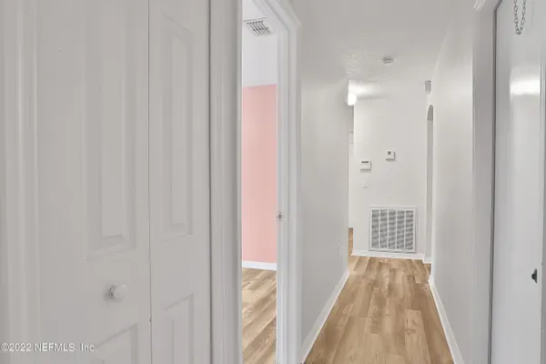 a view of a bathroom from the hallway