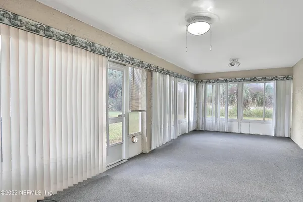 a view of a room with windows