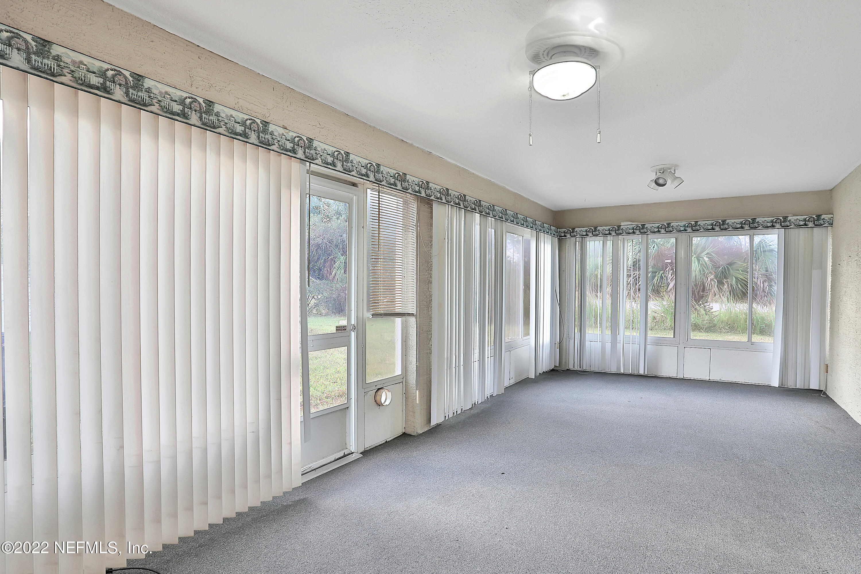11 Wheatfield Drive Palm Coast, FL 32164 - Photo 31 of 36 a view of a room with windows