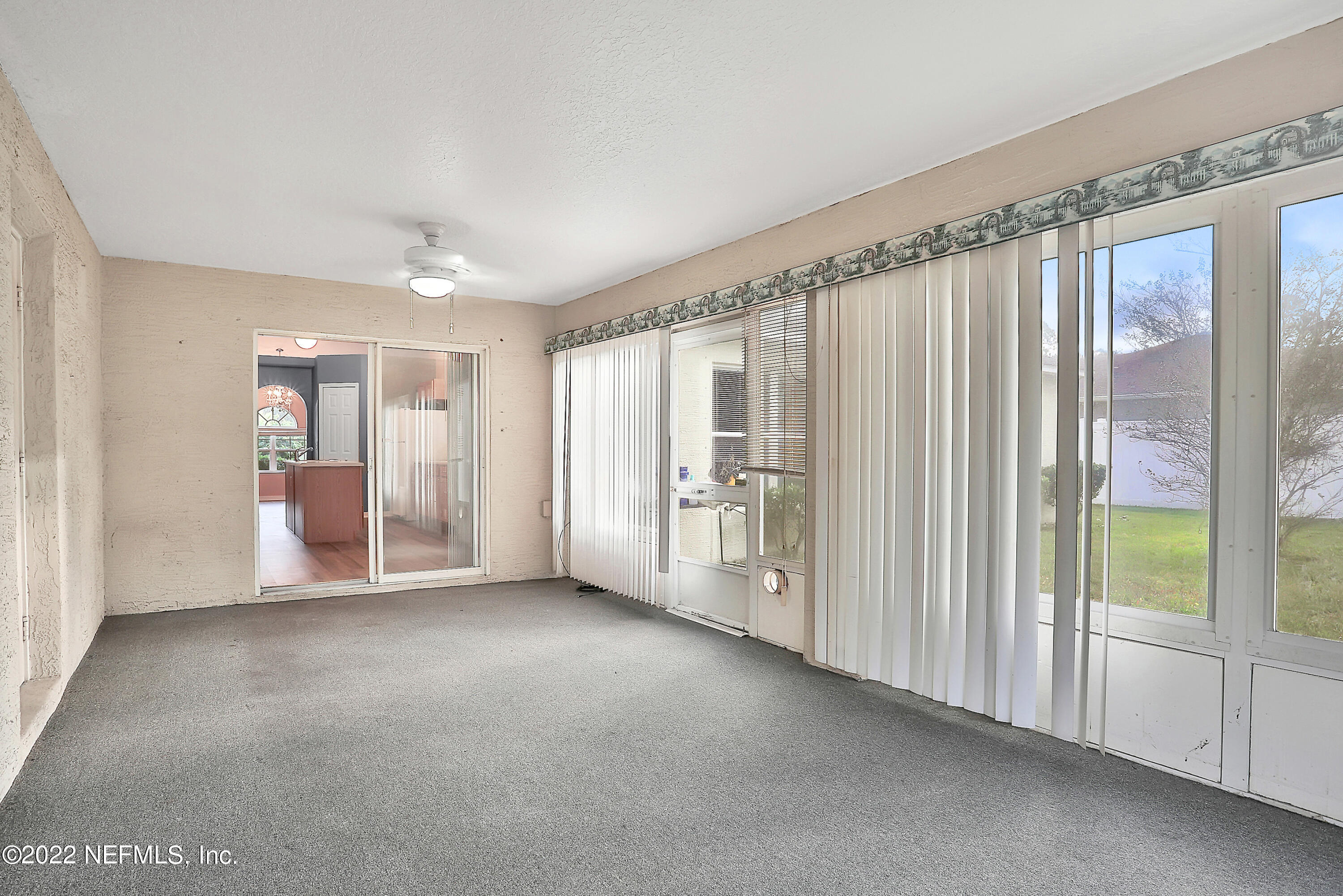 11 Wheatfield Drive Palm Coast, FL 32164 - Photo 32 of 36 a view of a big room with windows and entryway view