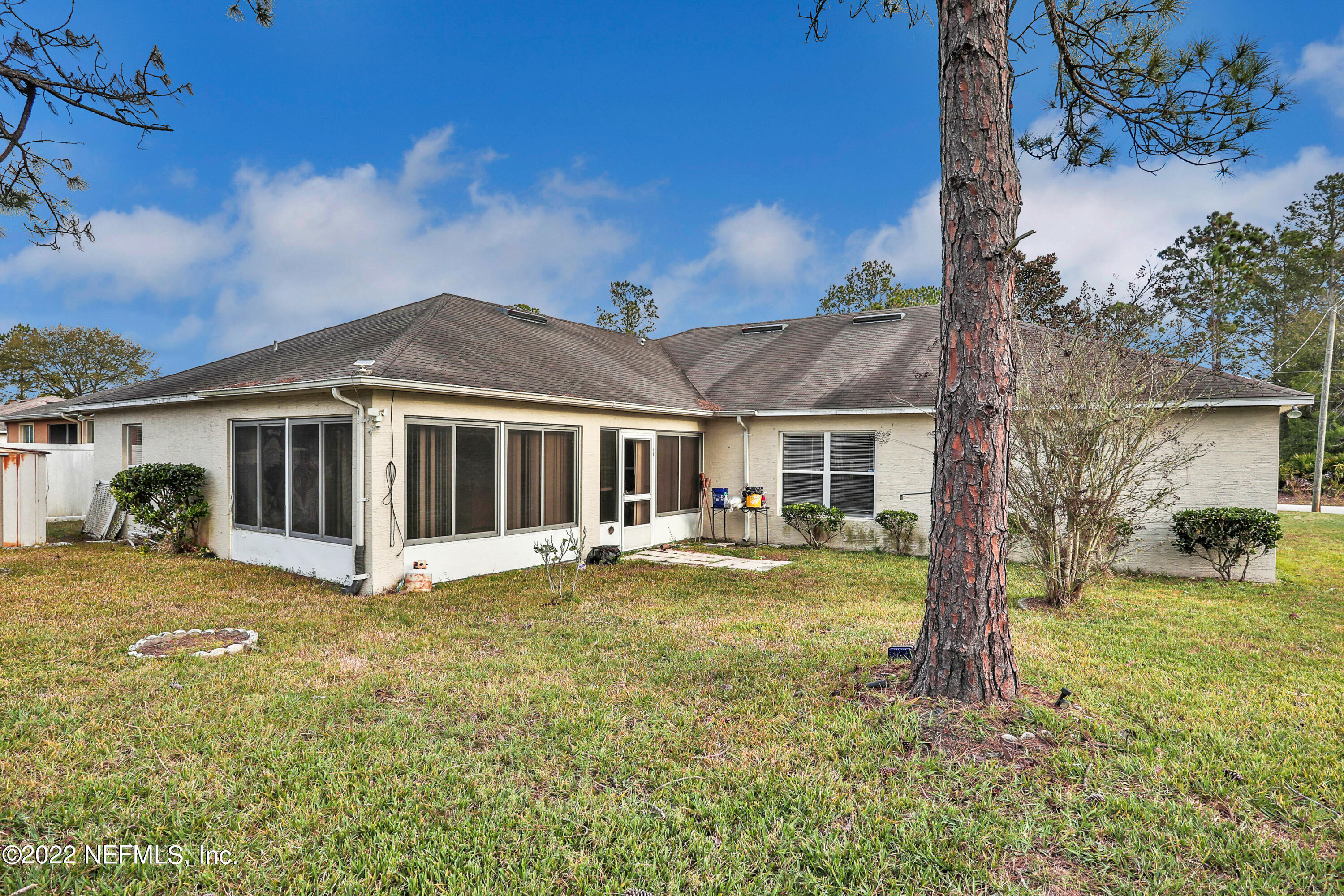11 Wheatfield Drive Palm Coast, FL 32164 - Photo 35 of 36 a view of a house with swimming pool and a yard