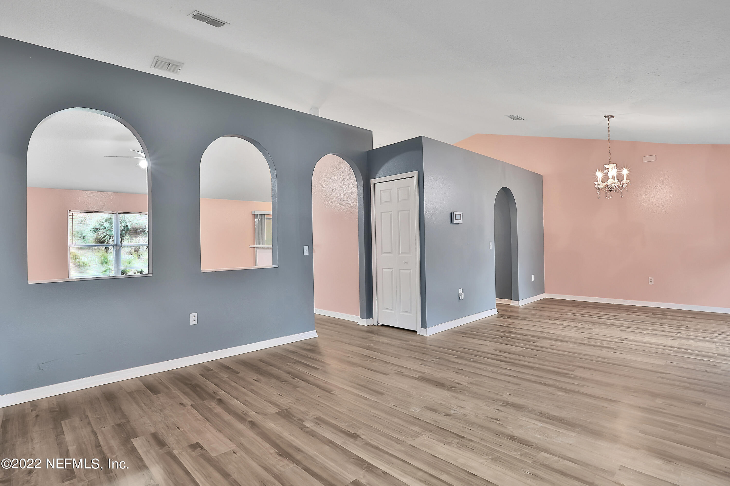 11 Wheatfield Drive Palm Coast, FL 32164 - Photo 4 of 36 a view of empty room with wooden floor