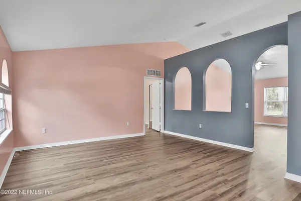 a view of room with window and bathroom
