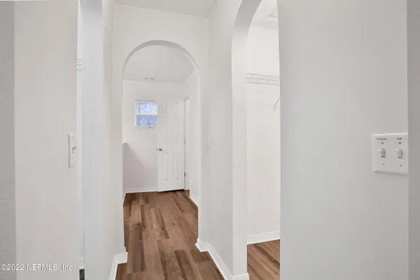 a view of front door with wooden floor