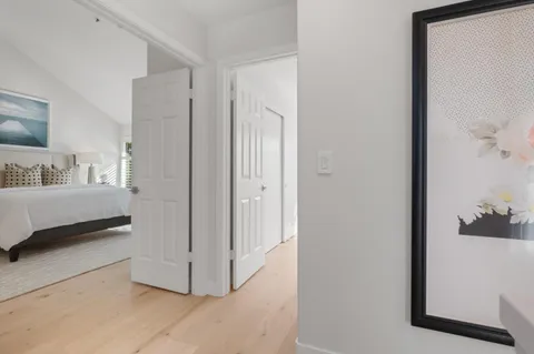 a bathroom with a double vanity sink toilet mirror and bathtub