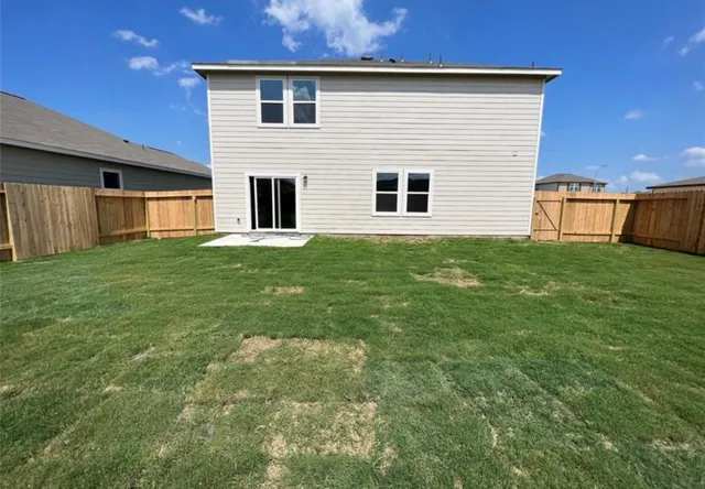 a view of a backyard of the house
