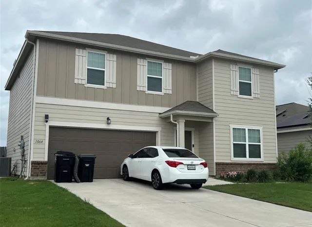a car parked in front of a house