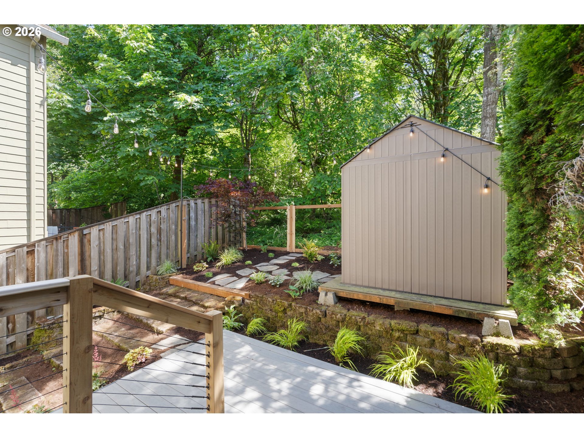 13159 Southwest Brianne Way Portland, OR 97223 - Photo 28 of 32 a view of backyard with small cabin and wooden fence