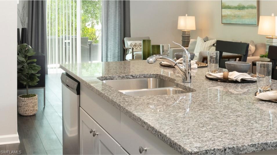 12240 Dakota Ridge Place North Fort Myers, FL 33917 - Photo 12 of 32 a kitchen with sink and view living room
