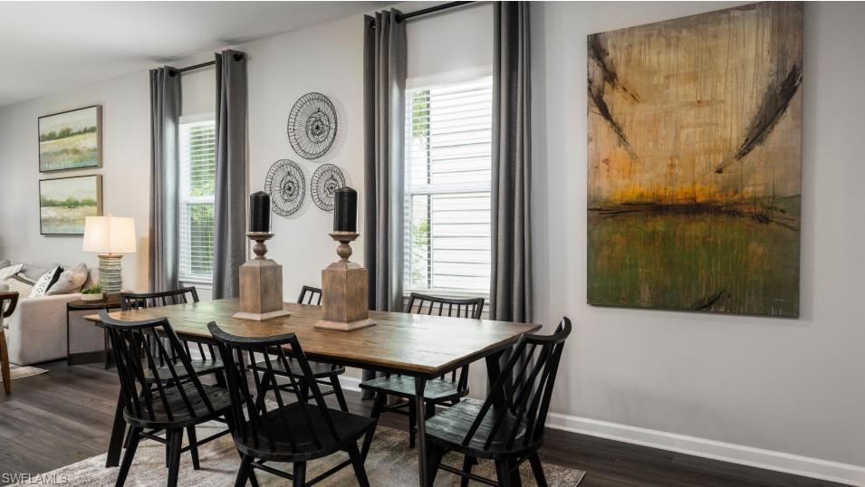 12240 Dakota Ridge Place North Fort Myers, FL 33917 - Photo 14 of 32 a view of a dining room with furniture and window