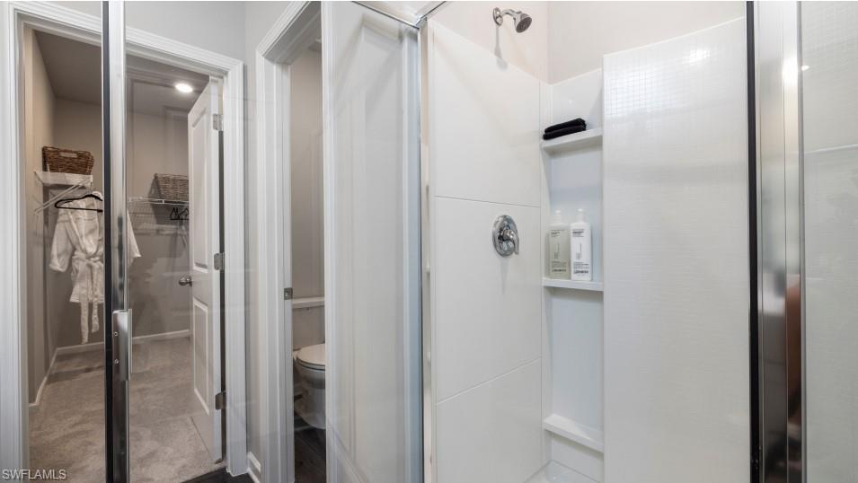 12240 Dakota Ridge Place North Fort Myers, FL 33917 - Photo 24 of 32 a bathroom with a shower and a mirror