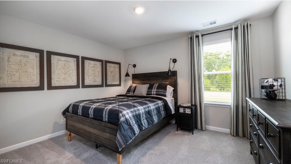 12240 Dakota Ridge Place North Fort Myers, FL 33917 - Photo 25 of 32 a bedroom with a bed and a window